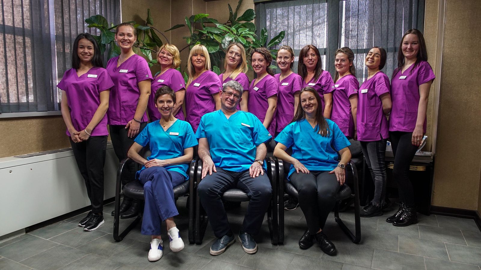 Dr. Vadim and Dr. Vera Khrakovsky with the Bright Smile Dental team at their Coney Island office in Brooklyn